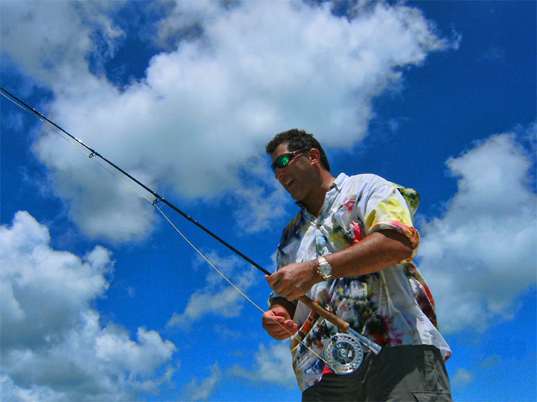 Joseph Koenig enjoying a colorful day of fishing the Ambergris Caye flats, Iguana Caye